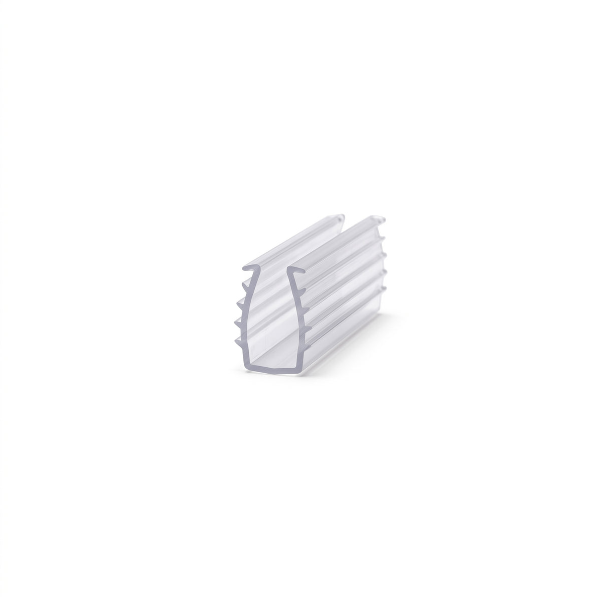 Short piece of clear frame seal on white, U-channel with barbed fins along one outer wall