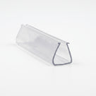 Clear PVC frame seal offcut on white, end-on view showing a deep U-channel with a lipped slot