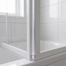 White X-profile seal fitted between the folding panels of a concertina bath screen