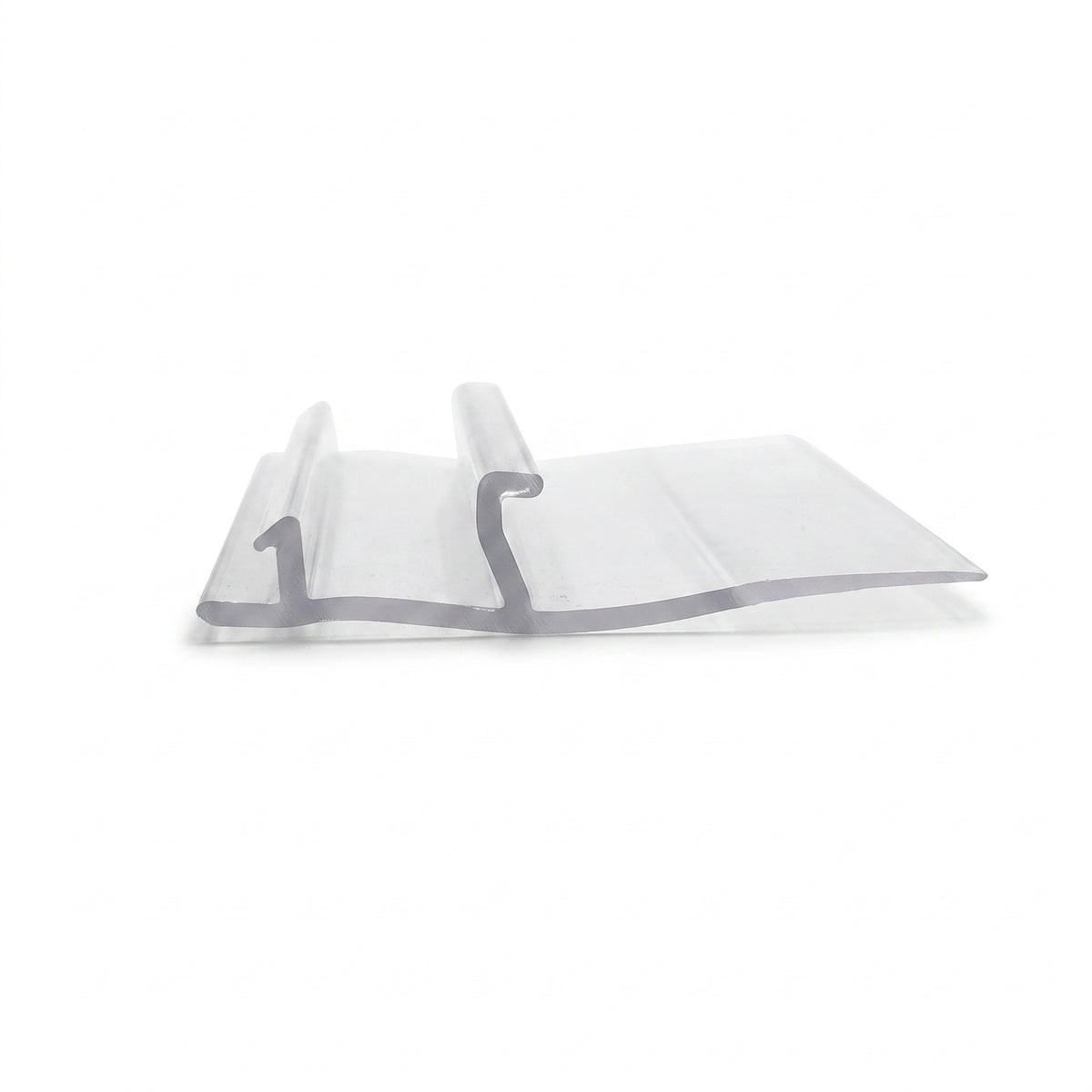Clear frame seal offcut on white, flat strip with two hooked locating ribs along one side