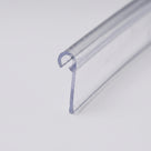 Clear rigid PVC hook-over seal length on white, curled hook along one edge and a flat sealing blade