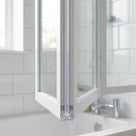 Clear semi-rigid seal fitted vertically on a folding bath screen upright, Bathstore Atlantes style