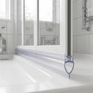 Clear seal with a teardrop loop under a dark-edged folding screen on a textured white tray