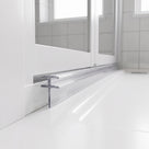 Clear T-head seal running the length of a white bifold door bottom rail above a white tray