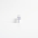 Small clear seal offcut end-on on white, double-flange T-head above a short straight blade