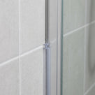 Clear 5mm T-head shower seal fitted vertically between a shower enclosure upright and a tiled wall
