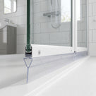 Clear seal with a pointed wedge and long tail under a white bifold door rail on a white tray