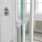 Clear 8mm T-head seal fitted vertically sealing the joint between two glass panels on a bifold door