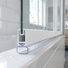 Clear seal with a wide flat hollow pad under a white bath screen rail, on a white bath