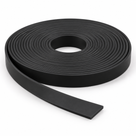 Coil of black silicone strip on a white ground, flat rectangular tail uncurling towards the front