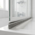 Brush seal with 6mm T backing and 10mm bristles bridging the gap under a bifold shower door