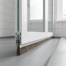 Brush seal with 6mm T backing and 8mm bristles fitted in the bottom channel of a bifold shower door