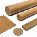 Tan phenolic laminate rods, a flat sheet, a thin strip and a small disc arranged on white