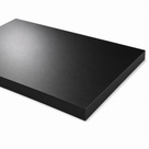 Black polyethylene slab angled on white, matt face and thick square-sawn edge