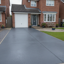 Dark grey anti-slip concrete floor and patio paint on a UK house driveway