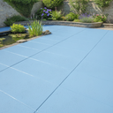 Light blue anti-slip concrete floor and patio paint on a UK garden patio beside a pond
