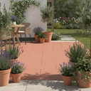 Terracotta anti-slip concrete floor and patio paint on a UK garden patio with Mediterranean planting