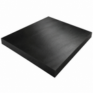 Thick square black nylon slab on white, deep sawn edge running along two sides