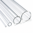 Four clear acrylic tubes of graduated bores lying together, cut ends towards the camera, on white.