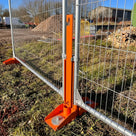 Locking Strap for Temporary Fence Anchoring Systems