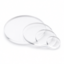 Four clear acrylic discs in different sizes on a white background