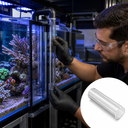 Aquarist in black gloves adjusting a clear acrylic overflow pipe on a reef tank; inset shows a plain clear tube.