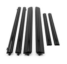 Six black door moulding pieces of varying lengths laid out, white background