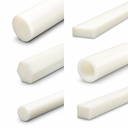 Six panels of white acetal stock on white - round, hexagonal and square bar, flat bar and a tube