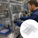 Technician working at a clear-panelled laboratory isolator with round acrylic ports; inset shows four plain clear tubes.
