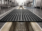 Close-up of the embossed pebble surface, bevelled edge and screw-fit earthing lead on blue ESD matting
