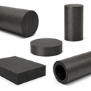Grouped charcoal grey nylon stock on white - round bar, a short billet, a disc, a plate and a tube