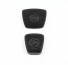 Pair of black ribbed rubber pedal pads with embossed logo, studio shot
