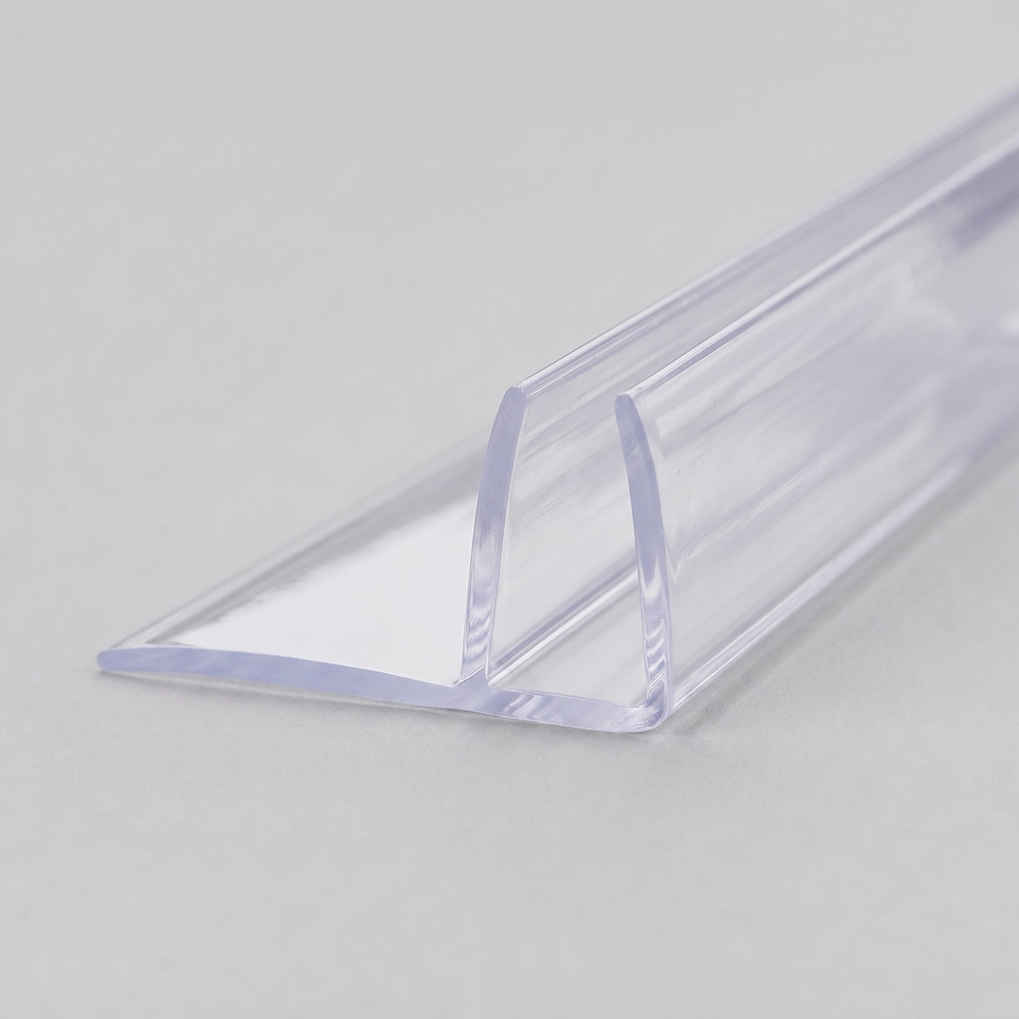 Clear vertical shower screen fin seal for 4-6mm glass - rigid PVC U-channel with soft fin blade, colourless clear finish
