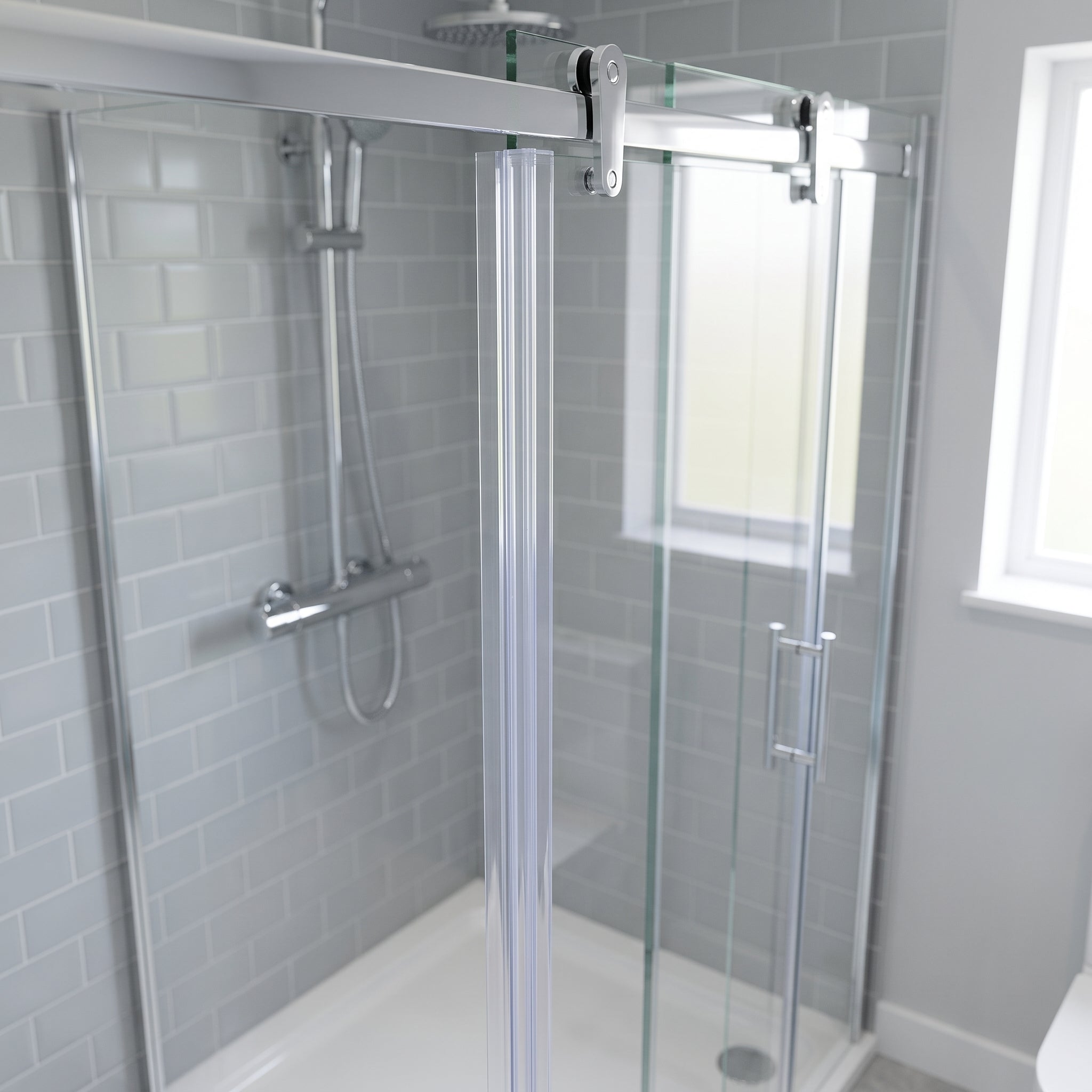Clear vertical fin seal running down the closing edge of a 6-8mm sliding shower door, fin closing the overlap gap to the fixed panel