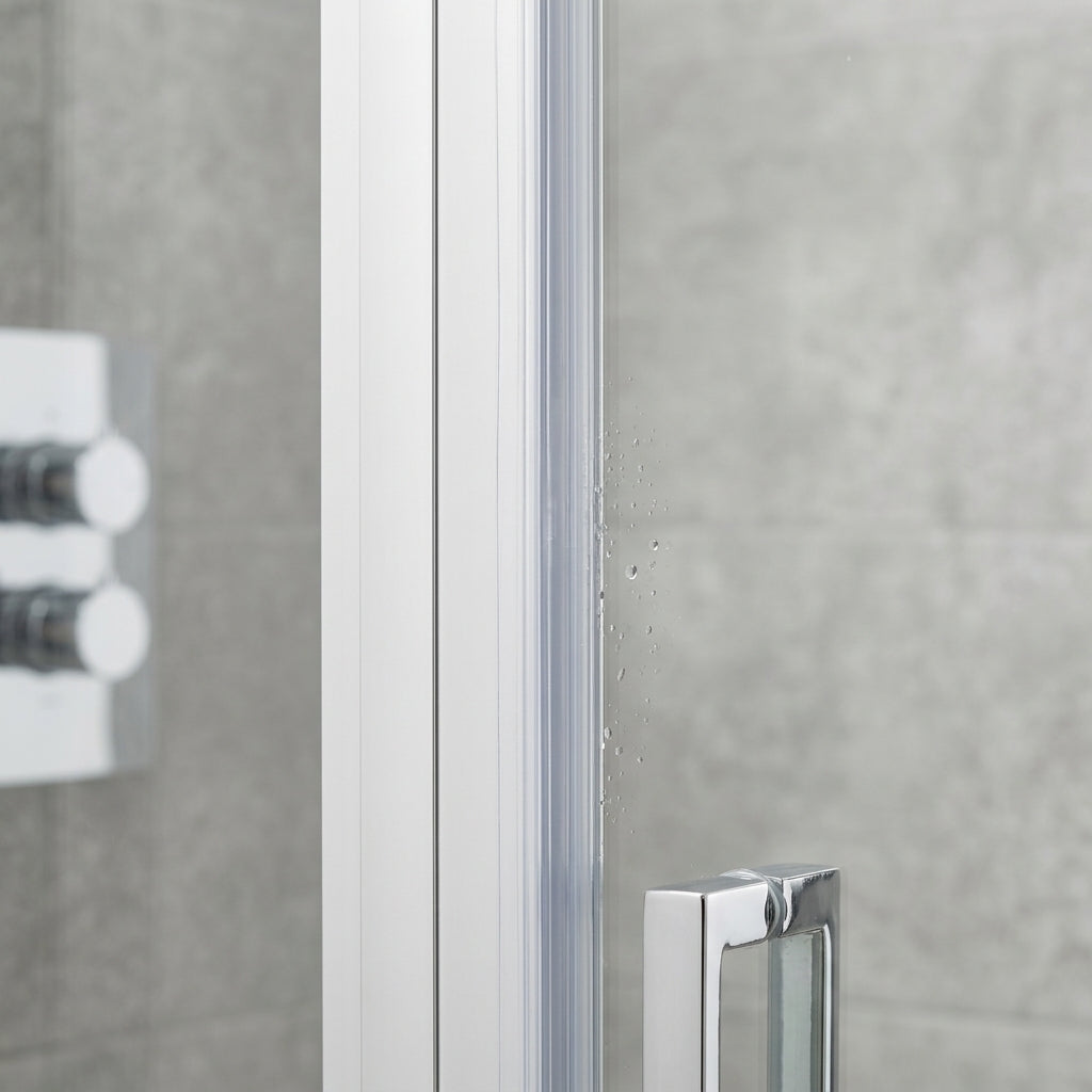 Clear self-adhesive vertical seal fitted to shower door frame upright - no tape visible when installed