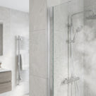 Clear self-adhesive vertical shower screen seal installed between glass and tiled wall - VHB tape hidden once fitted