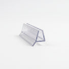 Clear seal offcut on white, trapezoid glass channel with a short rigid angled fin at the base