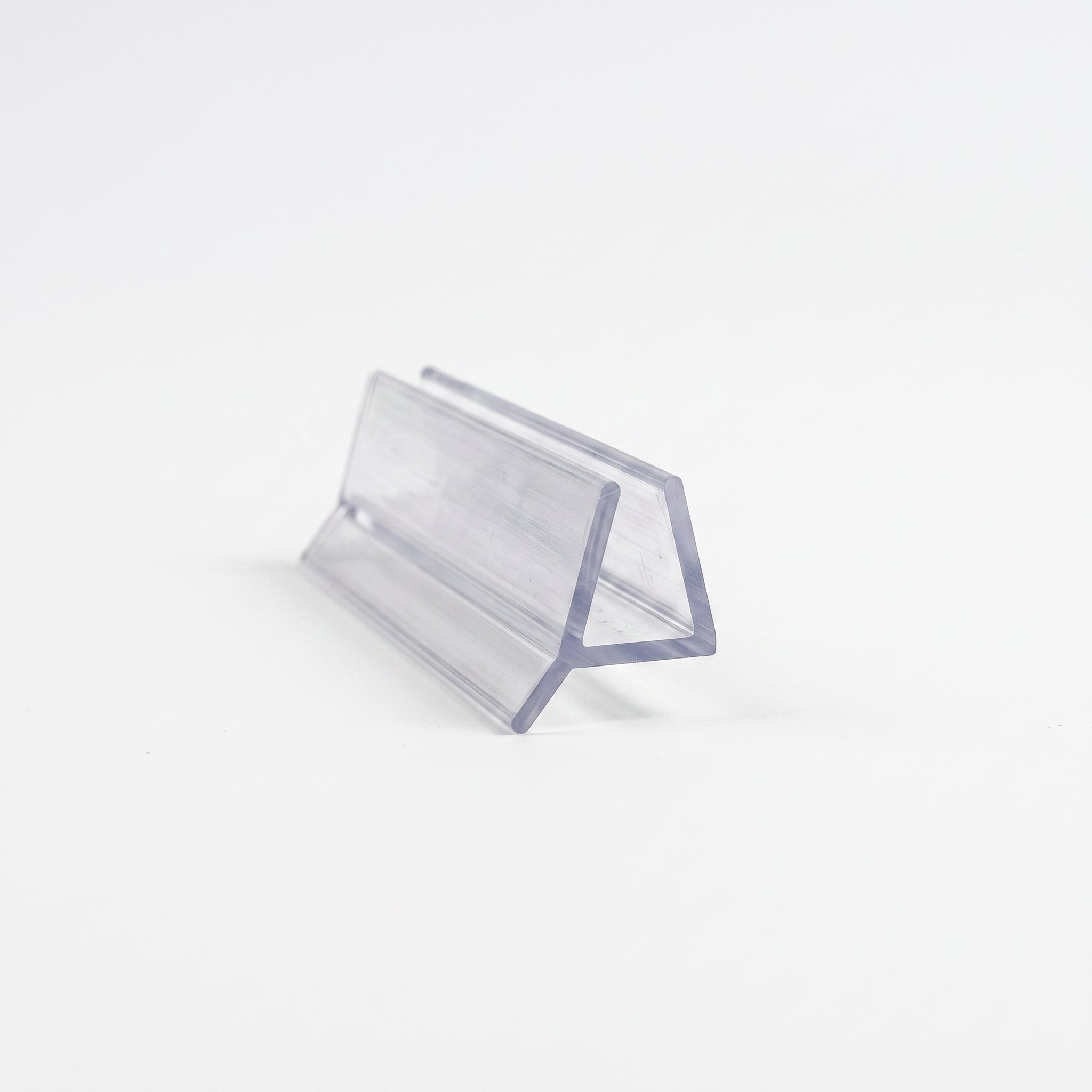 Cut length of FIN019 clear vertical seal - trapezoid channel for 4-6mm glass with rigid 5mm angled fin