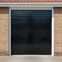 Black gloss paint freshly applied to an up-and-over garage door on a UK house