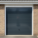 Dark grey gloss paint freshly applied to an up-and-over garage door on a UK house