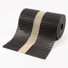 Roll of black open-grid matting with a pale photoluminescent centre band, partly unrolled on a white background