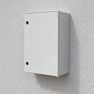 Illustrative wall-mounted grey GRP electrical cabinet installation