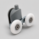 Grey plastic twin wheel shower door roller at an angle, showing the glass clamp, adjuster pin and two white wheels