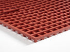Close-up of the cut edge showing 15mm thickness, ribbed bars and the support feet of the lower layer