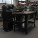 Black gloss machinery enamel paint applied to a machine base and workbench legs in a UK workshop