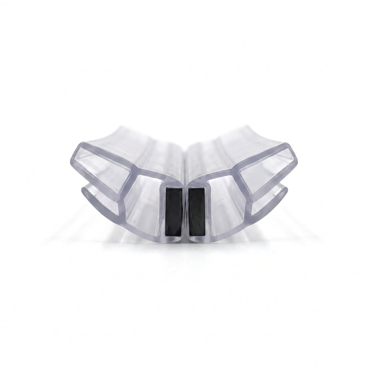 Two clear magnetic seal profiles meeting at an angle on white, black magnet strips touching at the centre