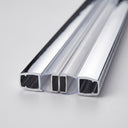 Chrome magnetic seal pair meeting magnet-to-magnet straight on white, chrome channels with black magnets in clear housings