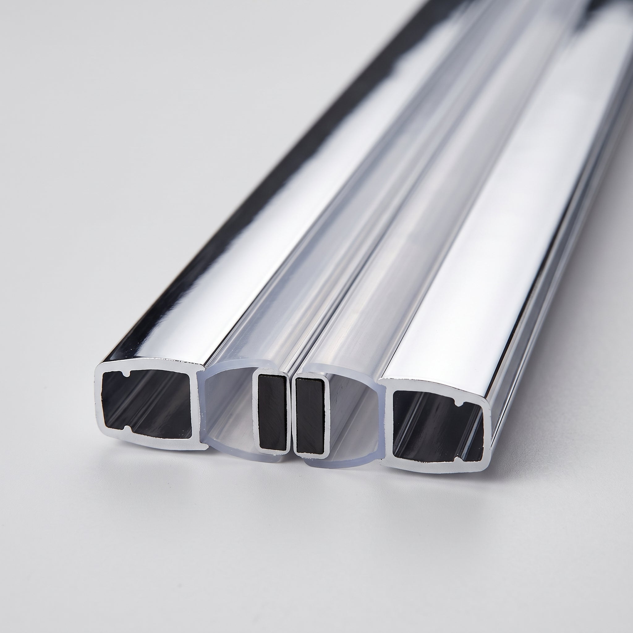 Chrome magnetic shower seal pair joined magnet-to-magnet in the straight 180 degree position - chrome channels, soft webs and black magnet strips