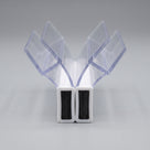 Pair of clear seals on white, angled to form a V, black magnet strips set into white housings at the base