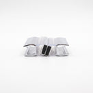 Two chrome-faced seal offcuts end-on on white, black magnets touching at the centre, channels facing out